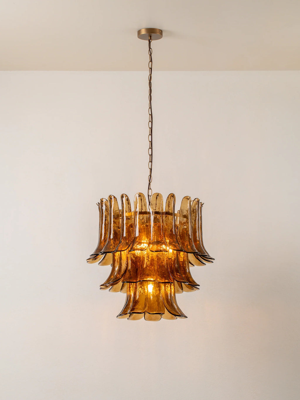 Lonso - 4 light aged brass and smoked brown glass chandelier