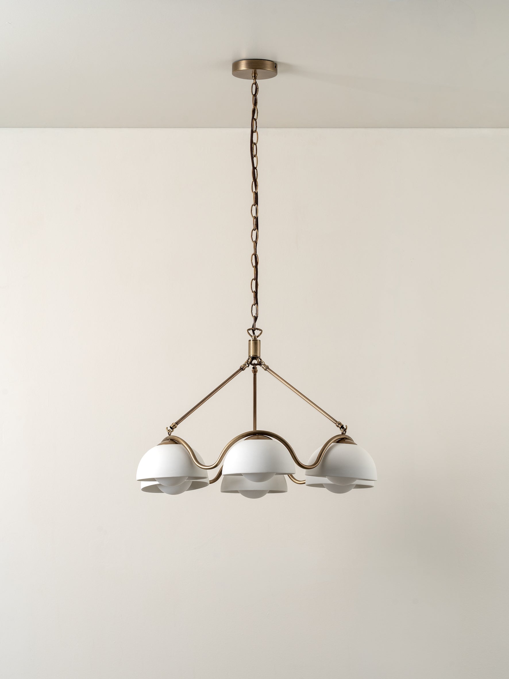 Waverly - 6 light aged brass and white porcelain pendant