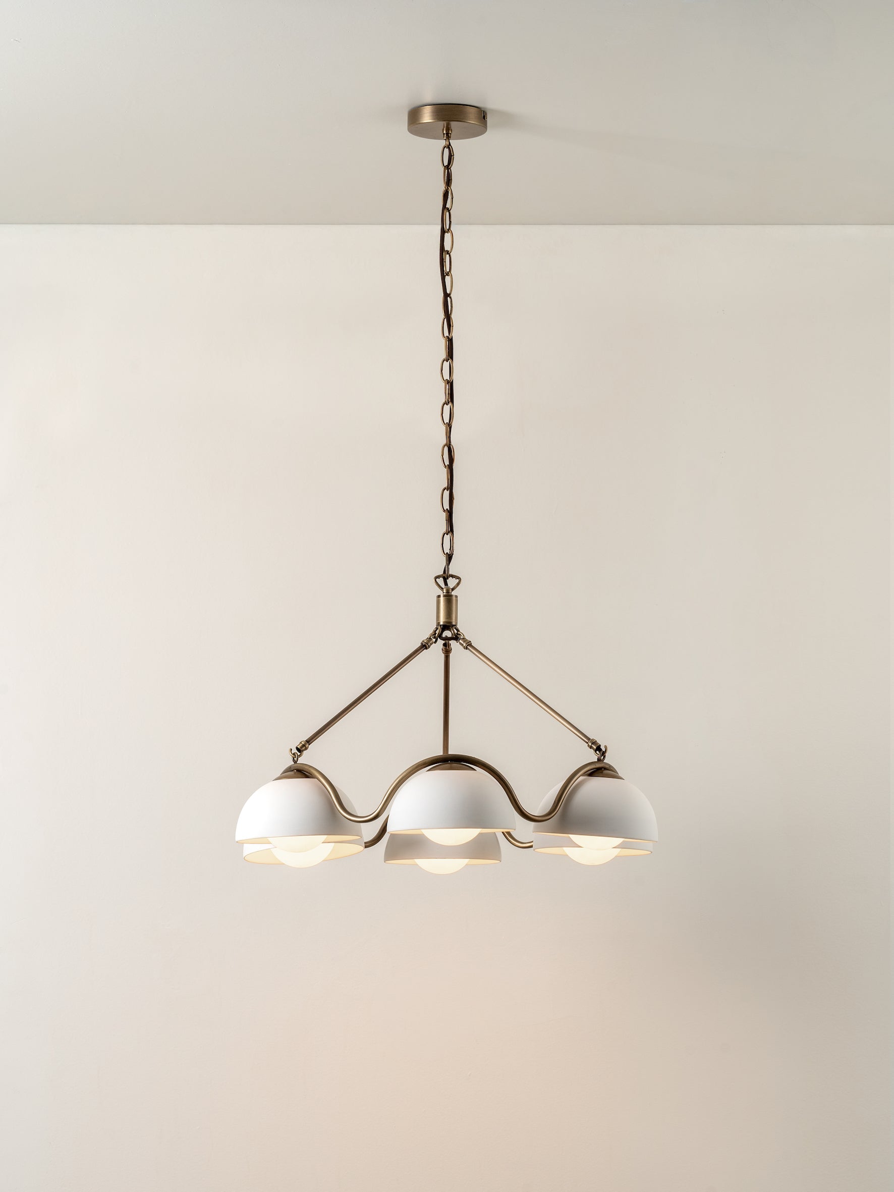 Waverly - 6 light aged brass and white porcelain pendant